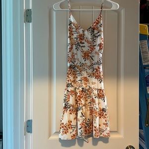 Floral Summer Dress with adjustable straps and ties in back.